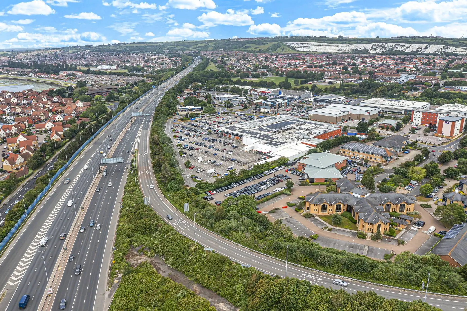 Aerial view of a motorway beside a business park near Portsmouth