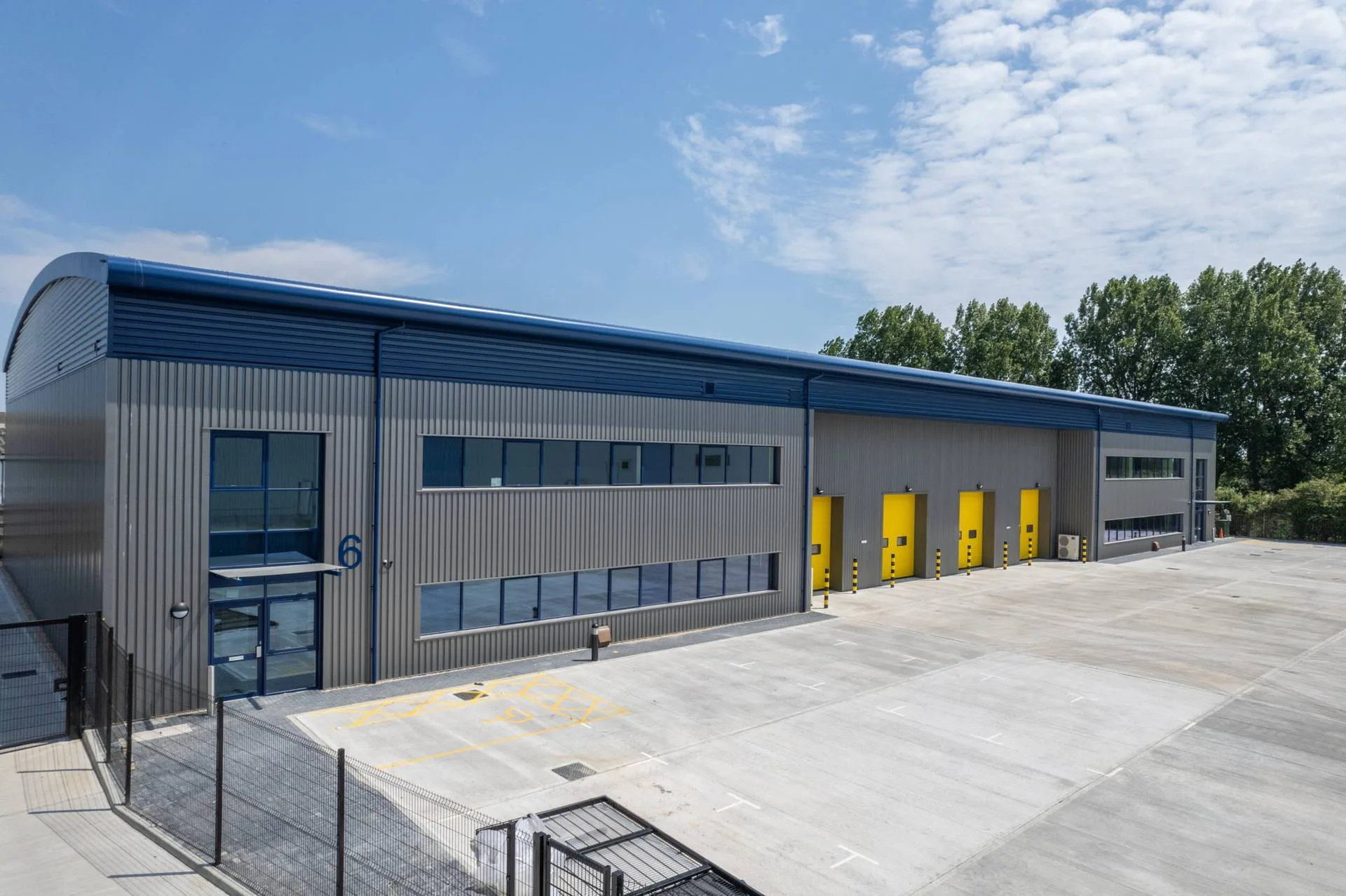 Modern industrial units with yellow loading doors