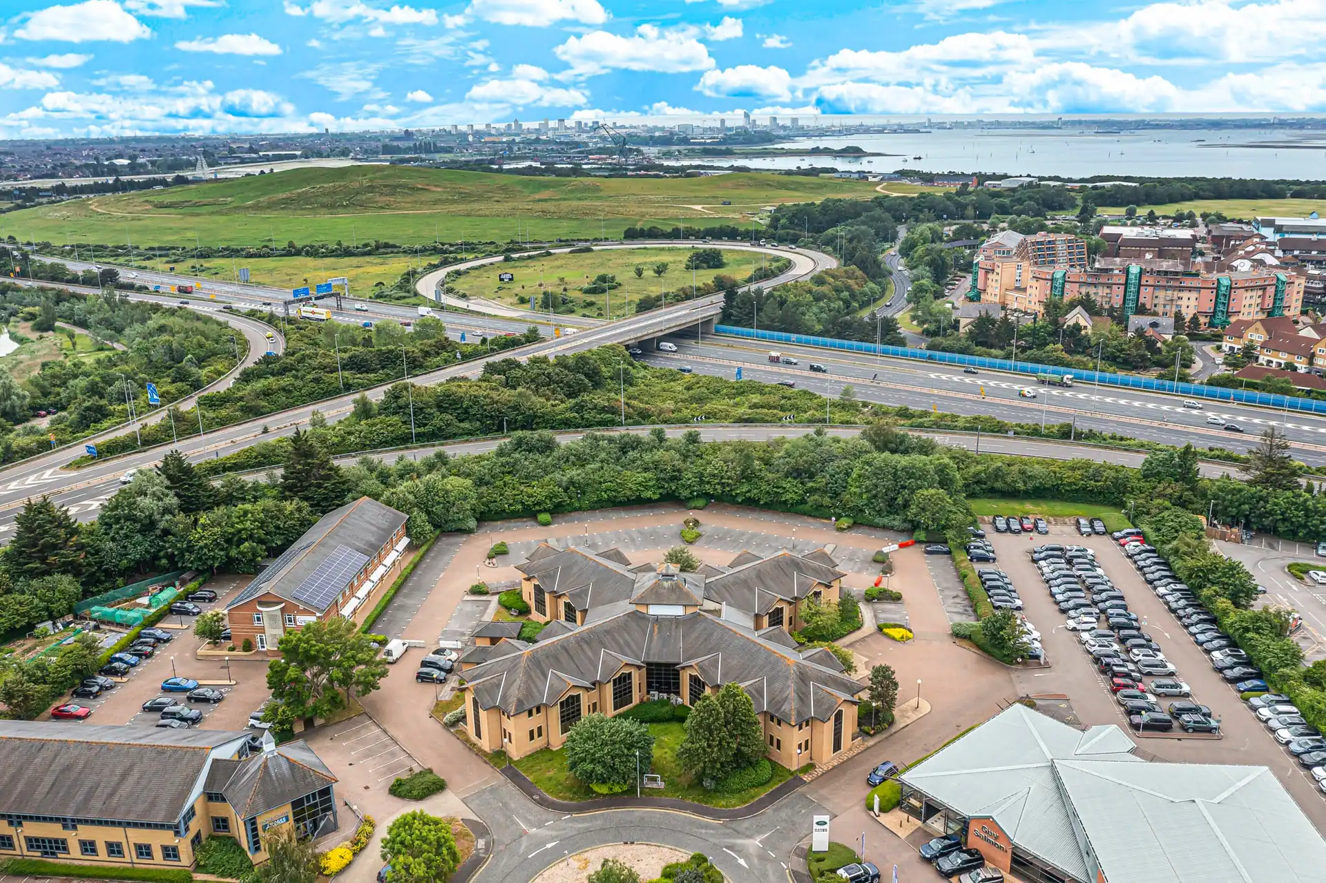 Aerial view of a business park beside a motorway junction near Portsmouth